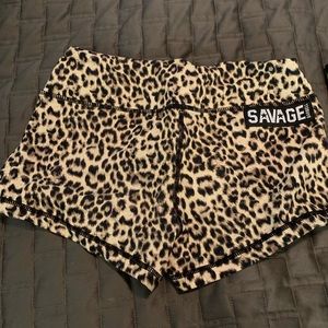 Savage Barbell leopard booty shorts.
